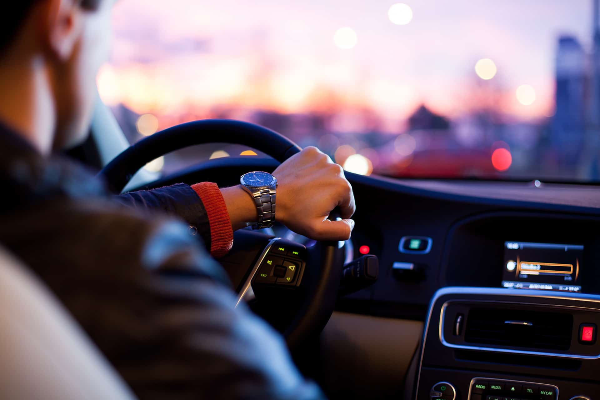 Person driving a car at sunset in Billings Montana.
